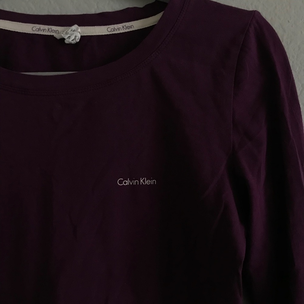 Identical long sleeve Calvin Klein shirts